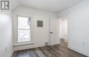 Hamilton (Stipley) apartment for rent - A room with a window and a door is shown in the image.