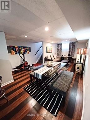 Toronto (Newtonbrook West) apartment for rent - A living room with a couch and a painting on the wall.
