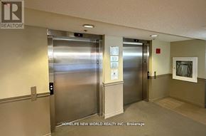 Toronto (Agincourt North) condo for rent - Two elevators in a hallway with a sign that says "HOMELIFE NEW WORLD REALTY INC., Brokerage".