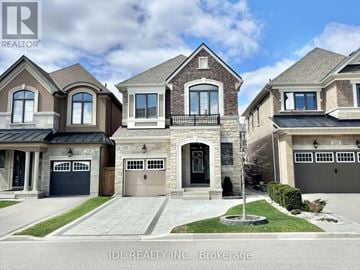 Vaughan (Kleinburg) apartment for rent - A row of houses with the logo JDL REALTY INC. Brokerage on the bottom left.