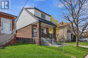 Toronto (Yorkdale-Glen Park) apartment for rent - A house with a white and grey exterior is for sale.