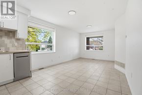 Toronto (Yorkdale-Glen Park) apartment for rent - A white room with a window and a trash bin.