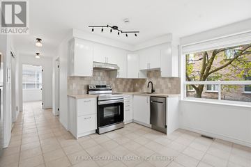 Toronto (Yorkdale-Glen Park) apartment for rent - A white kitchen with a stove top oven and a dishwasher.