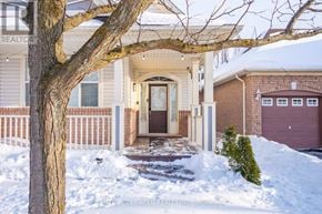 Milton (Be Beaty) apartment for rent - A house with a brown door and a tree in front of it.