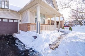 Milton (Be Beaty) apartment for rent - A house with a snow-covered driveway in front.