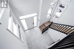 Pelham (Fonthill) apartment for rent - A staircase with a black railing and a white wall.
