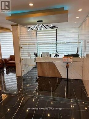 Toronto (Flemingdon Park) condo for rent - A reception area with a desk and a chair.