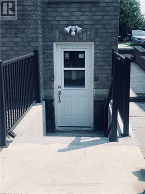 Whitby (Rolling Acres) apartment for rent - A white door with a black handle and a small window above it.