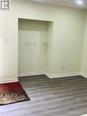 Whitby (Rolling Acres) apartment for rent - A room with a rug on the floor and a wall socket on the wall.