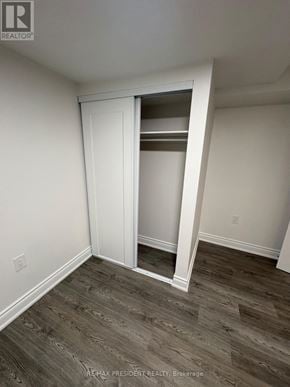 Pickering (Brock Ridge) apartment for rent - A room with a white door and a wooden floor.