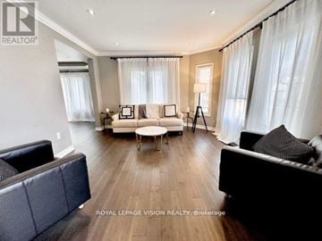 Richmond Hill (Westbrook) apartment for rent - A spacious living room with a black couch and a white sofa.