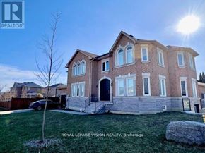 Richmond Hill (Westbrook) apartment for rent - A large brick house with a car parked in front.