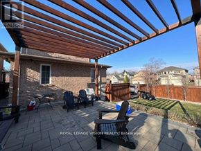 Richmond Hill (Westbrook) apartment for rent - A patio with a wooden pergola and chairs.