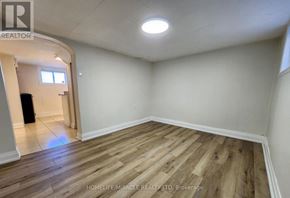 Hamilton (Homeside) apartment for rent - A room with wooden flooring and a window.