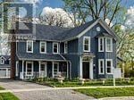 Markham (Unionville) apartment for rent - A blue house with white trim and a brick foundation.