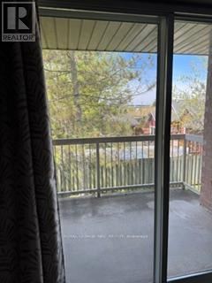 Welland (Prince Charles) condo for rent - A balcony with a view of a residential area.