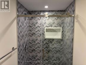 Markham (Milliken Mills East) apartment for rent - A bathroom with a shower curtain and a glass door.