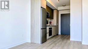 Toronto (Newtonbrook West) condo for rent - A kitchen with a refrigerator, microwave, and oven.