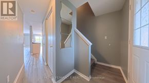 Kitchener townhouse for rent - A room with a large window and sliding glass doors.