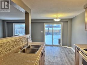 Kitchener townhouse for rent - A kitchen with a sink and a window.