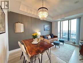 Richmond Hill (Langstaff) condo for rent - A dining room with a wooden table and chairs.