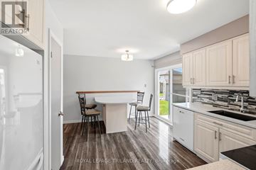 London East (East I) duplex for rent - A kitchen with a table and chairs in the middle of the room.