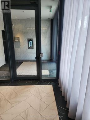 Toronto (Annex) condo for rent - A bathroom with a glass door and a marble floor.
