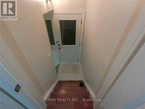 Toronto (Parkwoods-Donalda) duplex for rent - A stairway with a glass door leading to a landing.