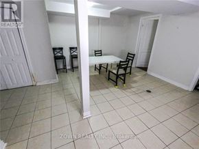 Toronto (Parkwoods-Donalda) duplex for rent - A white room with a table and chairs.