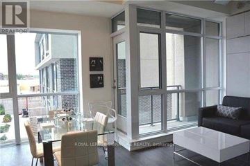 Toronto (Banbury-Don Mills) condo for rent - A modern living room with a glass table and chairs.