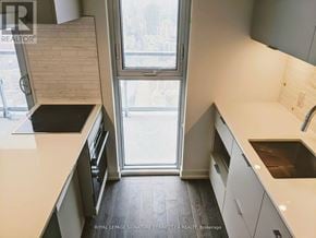 Toronto (Waterfront Communities) condo for rent - A kitchen with a window seat and a sink.