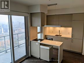 Toronto (Waterfront Communities) condo for rent - A kitchen with a view of the city.