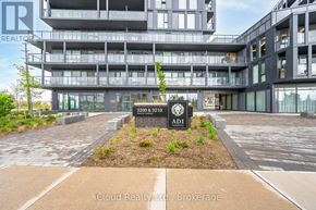 Burlington (Alton) condo for rent - The image shows a modern building with a sign that reads "ADI" in front of it.