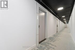 Burlington (Alton) condo for rent - A long hallway with doors on both sides.