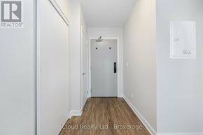 Burlington (Alton) condo for rent - A hallway with a door at the end.