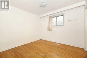 Toronto (Glenfield-Jane Heights) apartment for rent - A room with a window and wooden flooring.