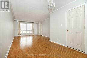 Toronto (Glenfield-Jane Heights) apartment for rent - A room with wooden floors and white walls.