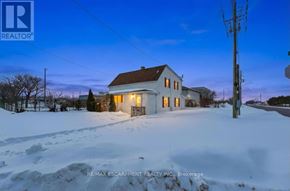 Hamilton (Stoney Creek Industrial) apartment for rent - A house with a sign RE/MAX Escarpment Realty Inc., Brokerage in front of it.