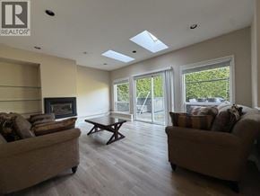 Richmond apartment for rent - A living room with a fireplace and two couches.