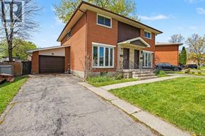 Cambridge apartment for rent - A house with a brown garage door and a brick exterior.
