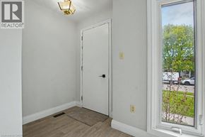 Cambridge apartment for rent - A room with a door and a window showing a tree outside.