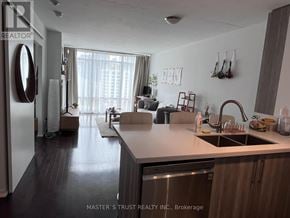 Toronto (Church-Yonge Corridor) condo for rent - A kitchen with a sink and a refrigerator.