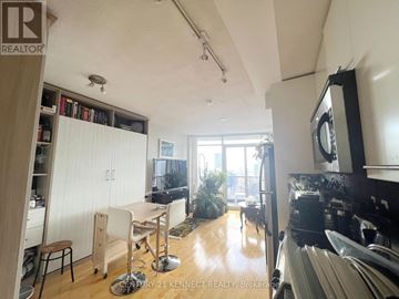Toronto (Church-Yonge Corridor) condo for rent - A kitchen with a table and chairs in the middle of the room.