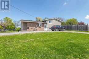 St. Catharines (Carlton/Bunting) apartment for rent - A house with a car parked in front of it.