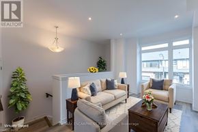 Brant (Paris) townhouse for rent - A living room with a couch, chairs, and a coffee table.