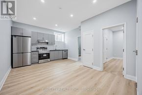 Toronto (Tam O'shanter-Sullivan) apartment for rent - A spacious kitchen with white cabinets and stainless steel appliances.