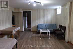 Toronto (L'amoreaux) apartment for rent - A room with a bed, a couch, a chair, and a dining table.