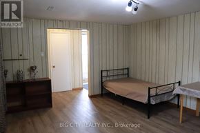 Toronto (L'amoreaux) apartment for rent - A bedroom with a bed, nightstand, and a dresser with a mirror.