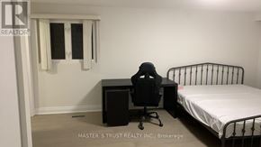 Toronto (Tam O'shanter-Sullivan) apartment for rent - A small bedroom with a bed, desk, and chair.
