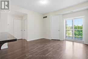 Guelph (Kortright West) condo for rent - A room with a sliding glass door leading to a balcony.